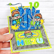 Sunny Studio Superhero with City Buildings Interactive Sliding Pop-up Birthday Card using Balloon Numbers Clear Craft Stamps