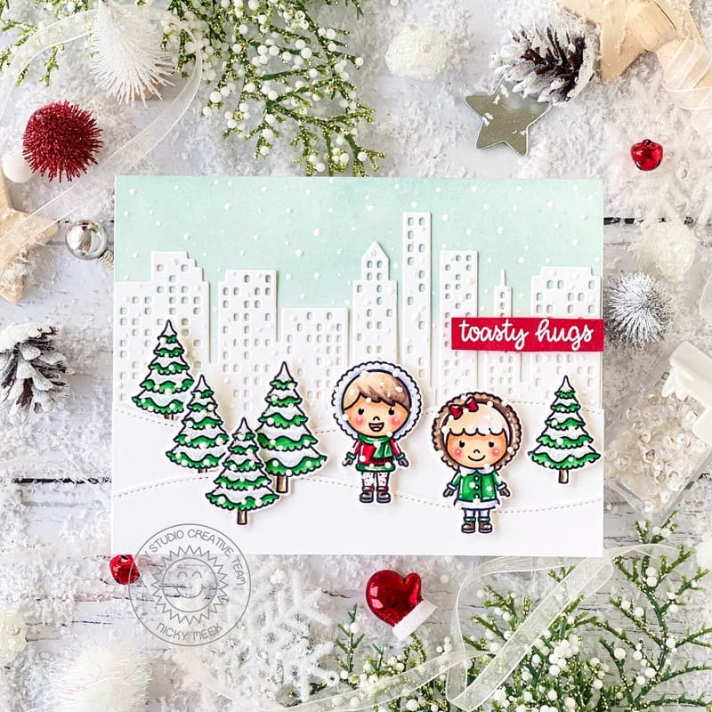 Sunny Studio Boy & Girl in City with Cityscape Buildings Snowy Holiday Christmas Card using Toasty Hugs Clear Craft Stamps