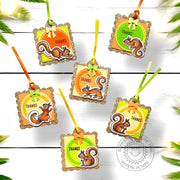 Autumn-colored "thank you" square gift tags with gold glitter scalloped edges, stamped label frames, ribbons, and squirrels.