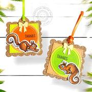 Two handmade hanging "thank you" gift tags with gold-glitter scalloped-edge borders, ribbon ties, & squirrel illustrations.