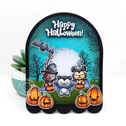 A scalloped Halloween card with cute critters, pumpkins, bats & the words “Happy Halloween!” on a teal night-sky background.