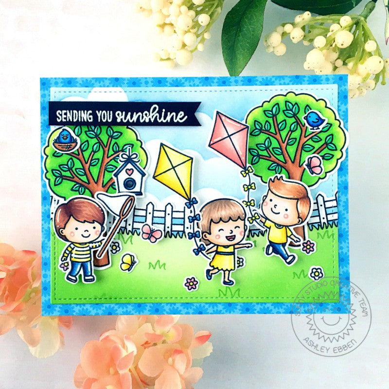 Sunny Studio Stamps Spring Themed Flying Kites with Trees, Fence & Birdhouses Handmade Card with custom sentiment greeting by Ashley Ebben (using Spring Scenes Background Border Stamps)