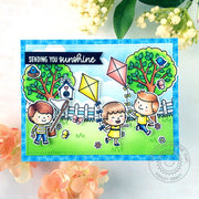 Sunny Studio Stamps Spring Showers Kids Flying Kites in backyard with trees and fence Handmade Card by Ashley Ebben
