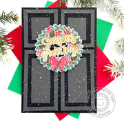 Christmas Card featuring a snowy black holiday door with a winter wreath, and layered with the phrase "Season's Greetings."
