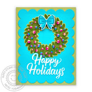 A scalloped Christmas card featuring a holiday wreath, decorated with two-tone pearls resembling vintage ornament baubles.